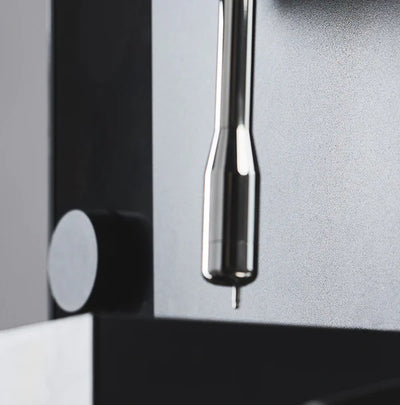 Close-up of the sleek design of the Fellow Espresso series 1 espresso machine, showcasing its precision components.